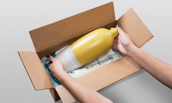 Product being bedded on an INSTAPAK QuickRT foam bag in a carton